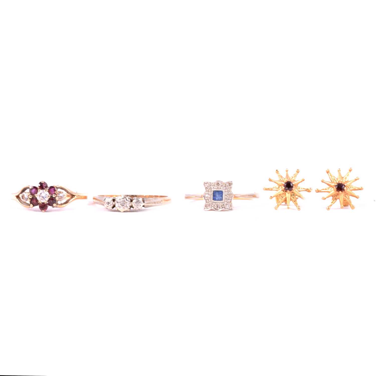 Lot 43 - Three gemset rings and a pair of earrings.