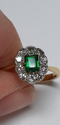 Lot 36 - Two gemset rings, emerald and diamond, garnet and diamond.