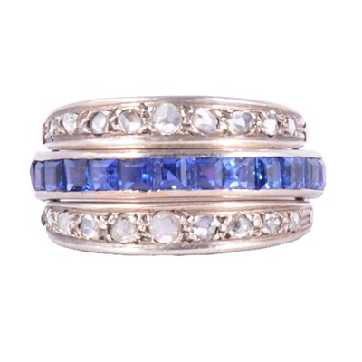 Lot 15 - A sapphire, ruby, and diamond night and day ring.