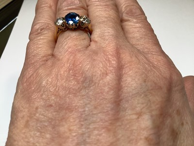 Lot 1 - A sapphire and diamond three stone ring.