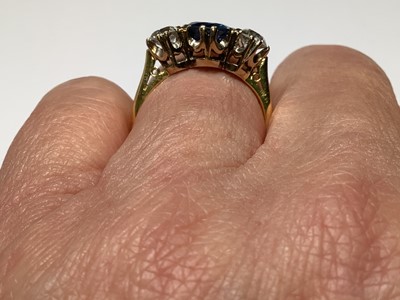 Lot 1 - A sapphire and diamond three stone ring.