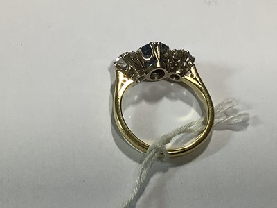 Lot 1 - A sapphire and diamond three stone ring.