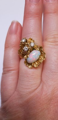 Lot 49 - A 1970's vintage opal and diamond ring.