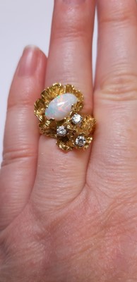 Lot 49 - A 1970's vintage opal and diamond ring.