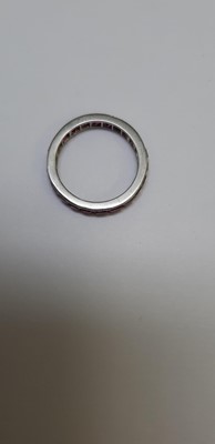Lot 41 - A ruby full eternity ring.