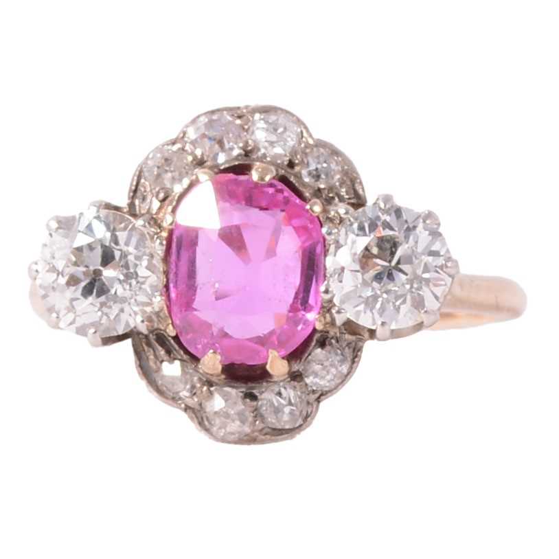 Lot 32 - CATALOGUE AMENDMENT- A pink corundum and diamond cluster ring.