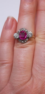 Lot 32 - CATALOGUE AMENDMENT- A pink corundum and diamond cluster ring.
