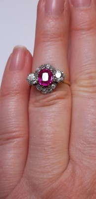 Lot 32 - CATALOGUE AMENDMENT- A pink corundum and diamond cluster ring.