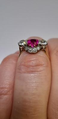 Lot 32 - CATALOGUE AMENDMENT- A pink corundum and diamond cluster ring.