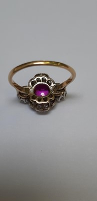 Lot 32 - CATALOGUE AMENDMENT- A pink corundum and diamond cluster ring.