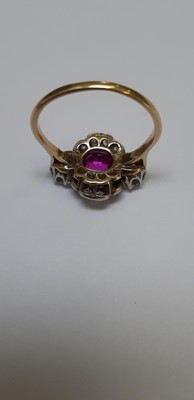 Lot 32 - CATALOGUE AMENDMENT- A pink corundum and diamond cluster ring.