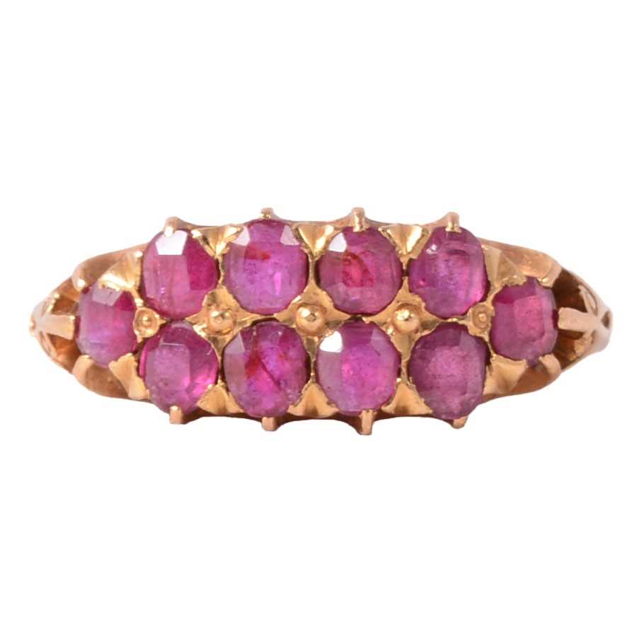 Lot 37 - A ruby half hoop ring.