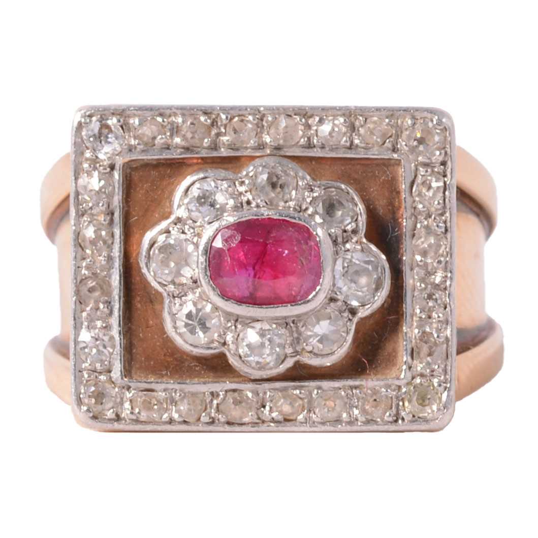 Lot 33 - A ruby and diamond square cluster ring on a heavy band.