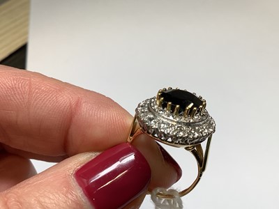 Lot 6 - A large sapphire and diamond cluster ring.