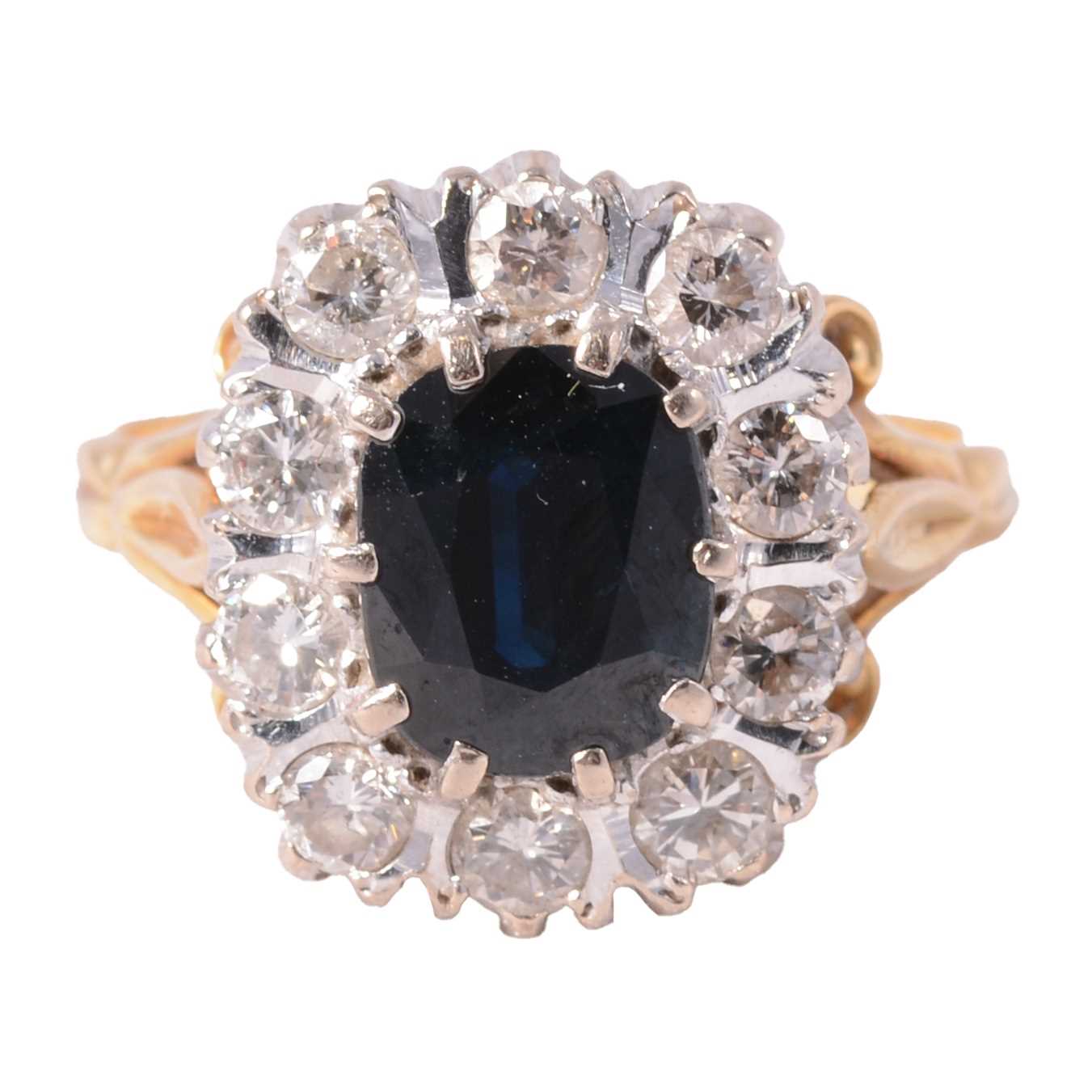 Lot 5 - A sapphire and diamond cluster ring.