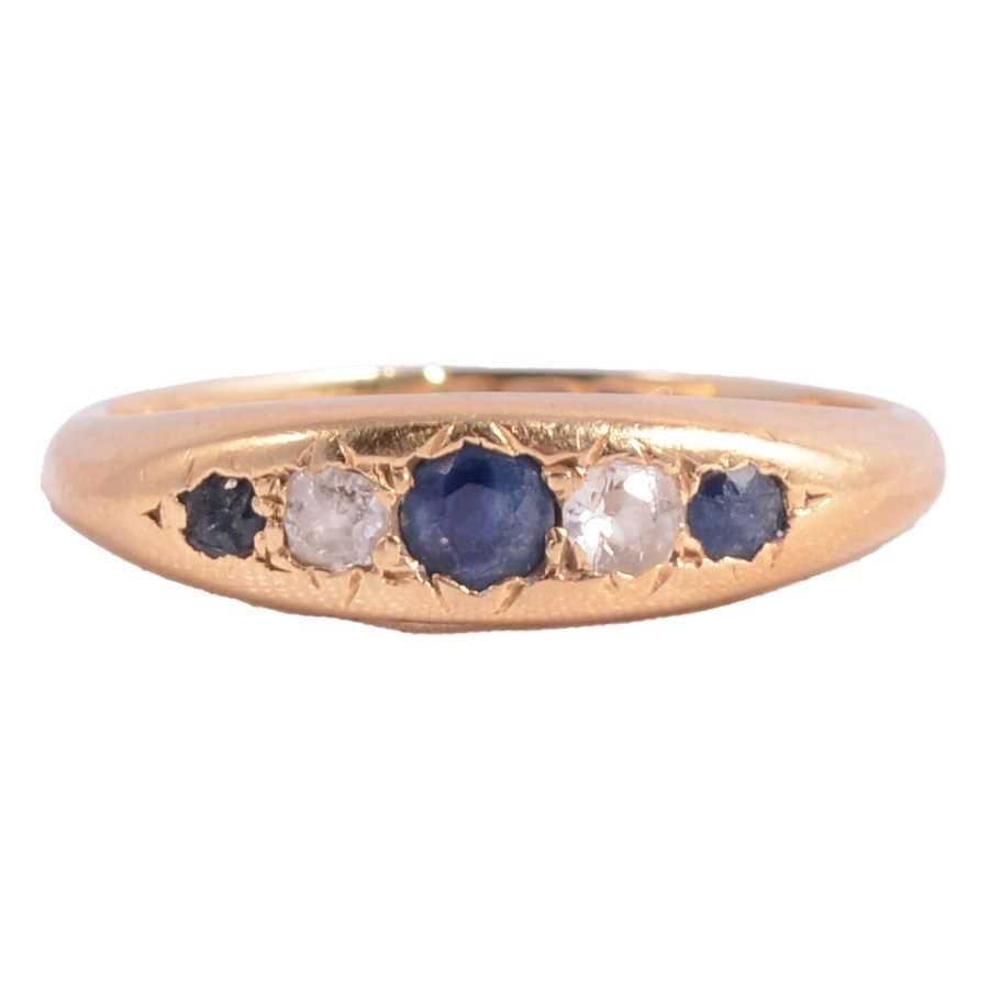 Lot 16 - A sapphire and diamond ring.