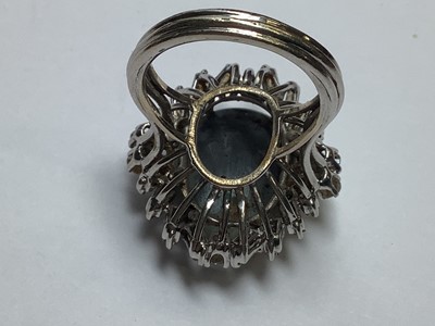 Lot 48 - A large black opal and diamond cluster ring.