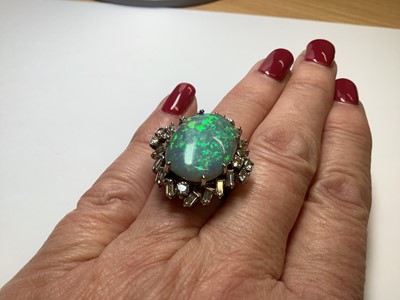 Lot 48 - A large black opal and diamond cluster ring.