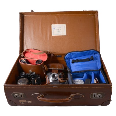 Lot 114 - A leather suitcase containing various items