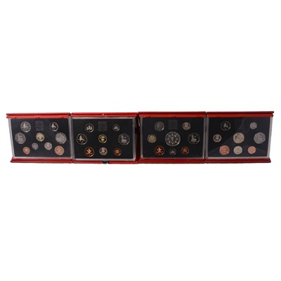Lot 218 - Nine Annual Proof Red Deluxe Coin Sets.