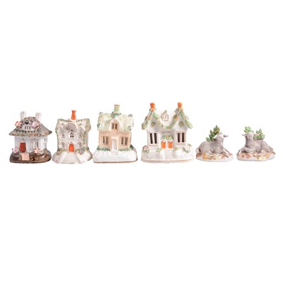 Lot 29 - Seven Staffordshire cottage pastille burners, pair of porcelain sheep models