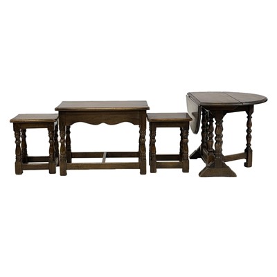 Lot 457 - Small oak occasional table and an oak next of three coffee tables