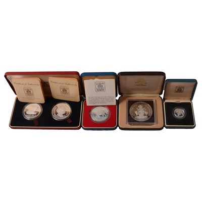 Lot 222 - Four silver coins / coin sets.