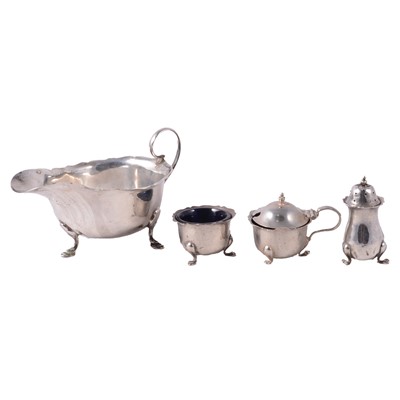 Lot 239 - Silver sauce boat and a silver three piece condiment set