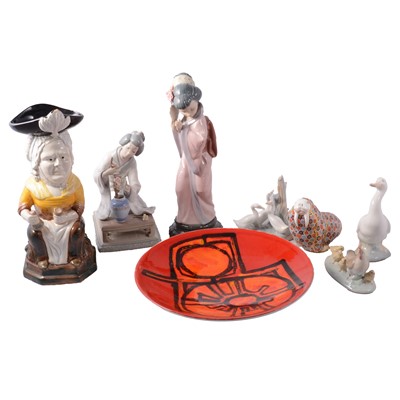 Lot 37 - A Royal Worcester walrus paperweight, Poole Dephis plate, two Lladro figures, three Nao, toby jug.