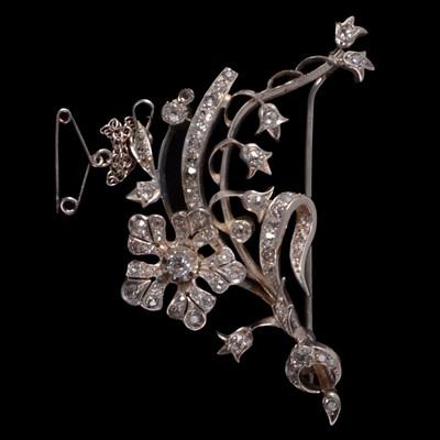 Lot 196 - A diamond set floral spray brooch.