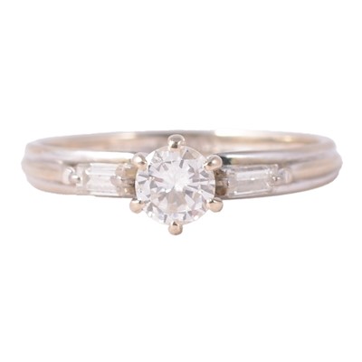 Lot 41 - A diamond three stone ring.