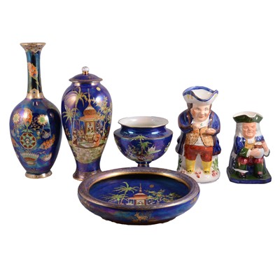 Lot 100 - A collection of Carlton ware blue lustre ceramics and two Toby jugs.