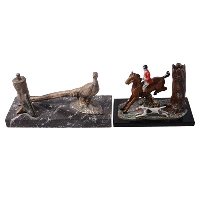 Lot 79 - Two cold-painted figural match strikers - hunting related