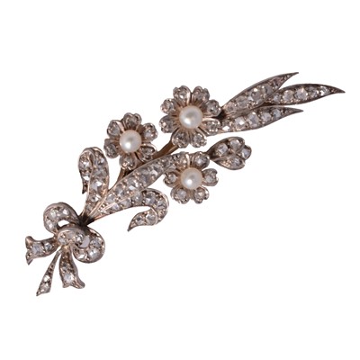 Lot 195 - A diamond and pearl floral spray brooch.
