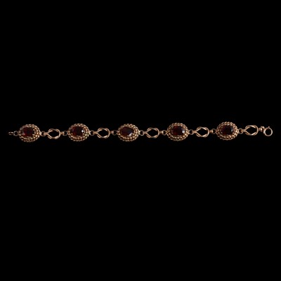 Lot 244 - A garnet bracelet.