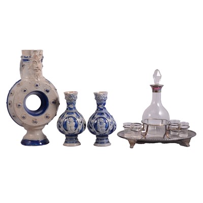 Lot 73 - German salt-glazed ewers, flagon, and silver-necked decanter