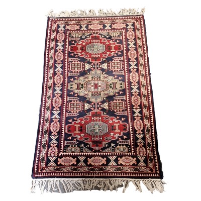 Lot 554 - Caucasian rug, three large lozenge medallions...