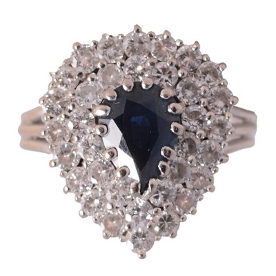Lot 19 - A sapphire and diamond pear shaped cluster ring.