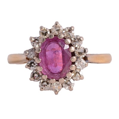 Lot 10 - A ruby and diamond cluster ring.