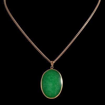 Lot 343 - A jadeite pendant on a chain.