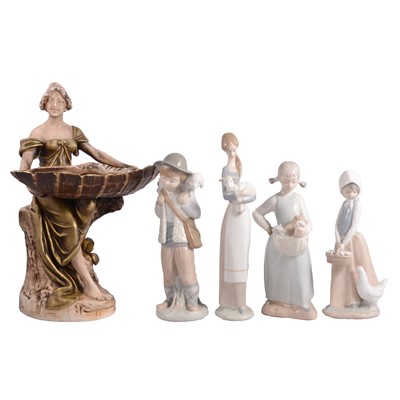 Lot 22 - Royal Dux figure, 1775; a Lladro figurine; and three Nao figurines