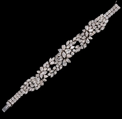 Lot 242 - A diamond bracelet set with marquise, pear and brilliant cut stones.