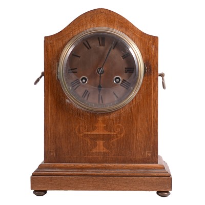 Lot 138 - 1910's oak and marquetry mantel clock