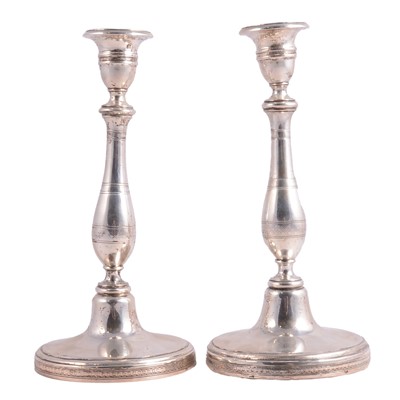 Lot 311 - Pair of Continental white metal candlesticks