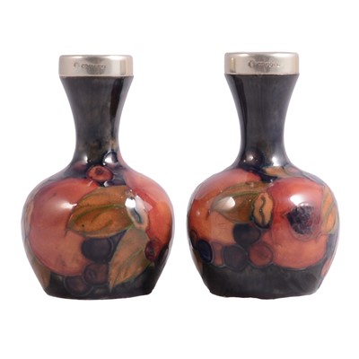 Lot 4 - Pair of Moorcroft pottery small bottle vases