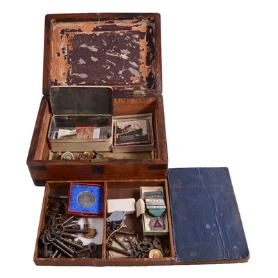Lot 156A - A wooden box with replica Lusitania medallion, badges, old keys etc.