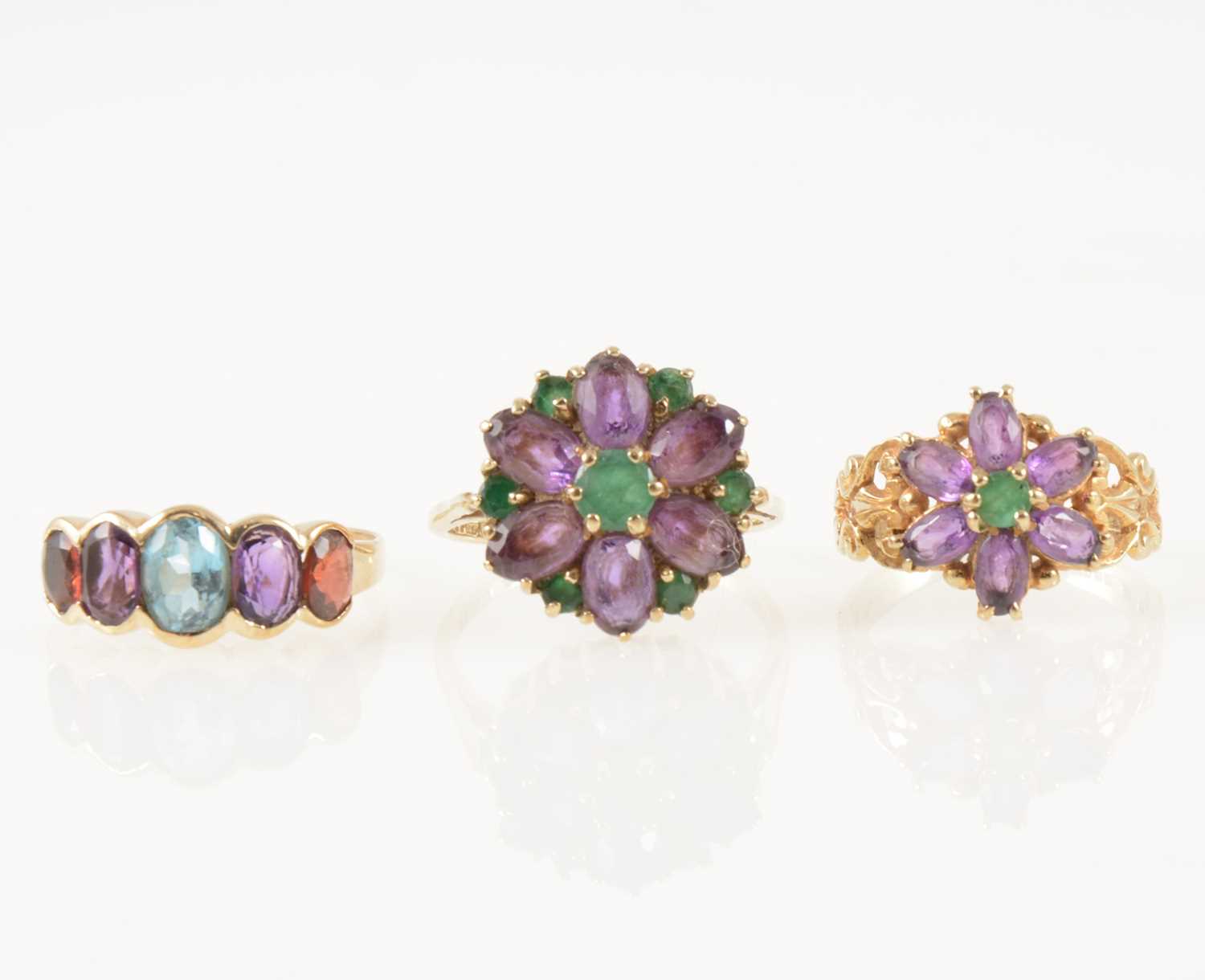 Lot 46 - Three vintage amethyst dress rings.