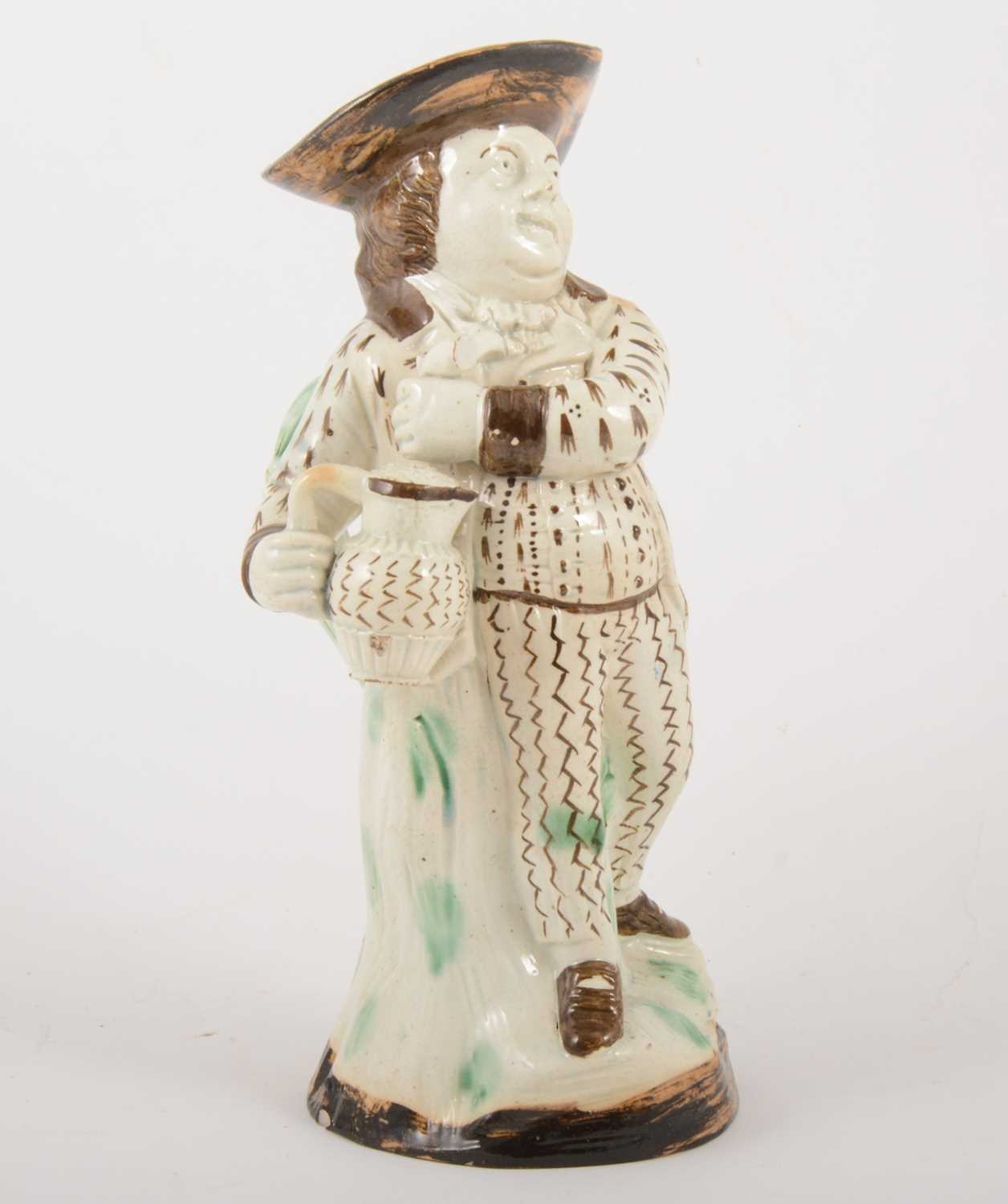 Lot 13 - A Pearlware type earthenware 'Hearty Goodfellow' Toby jug, early 19th centur