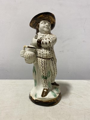 Lot 13 - A Pearlware type earthenware 'Hearty Goodfellow' Toby jug, early 19th centur