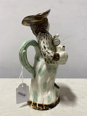 Lot 13 - A Pearlware type earthenware 'Hearty Goodfellow' Toby jug, early 19th centur